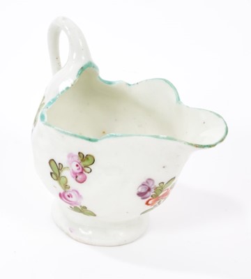 Lot 191 - A Lowestoft 'Dolphin Ewer' cream boat, painted in 'Tulip Painter' style, circa 1780