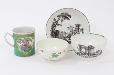 Lot 123 - A Worcester black printed saucer, a similar tea bowl, a Worcester small green ground mug and a polychrome tea bowl