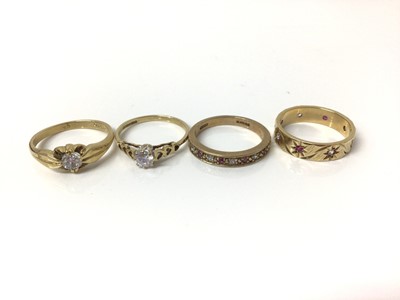 Lot 704 - Four 9ct gold gem set dress rings