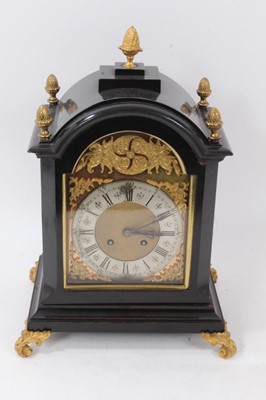 Lot 960 - Late 19th century bracket clock with 8 day striking movement, arched brass dial 
with cast spandrels in ebonized case with brass mounts, approximately 35cm 
high
