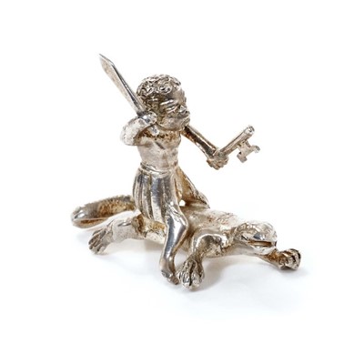 Lot 331 - Ealrly 20th century silver novelty miniature toy ornament of a figure on a Komodo dragon