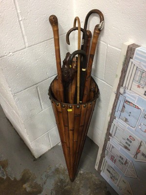 Lot 65 - Collection of walking sticks in simulated bamboo holder