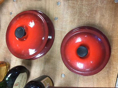 Lot 285 - Graduated set of four Le Cruset sauce pans in cerise red.