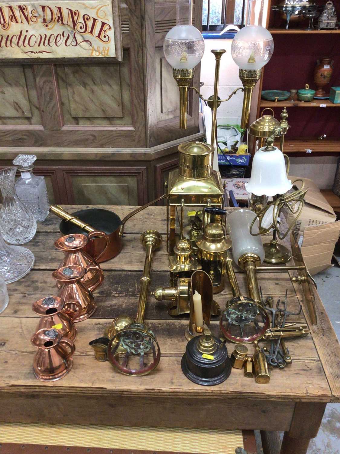 Lot 28 - Good collection of copper and brassware, including graduated jugs, oil lamps, etc