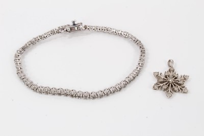 Lot 122 - Diamond tennis bracelet with clusters of diamonds in silver setting, together with a diamond snowflake pendant in silver setting