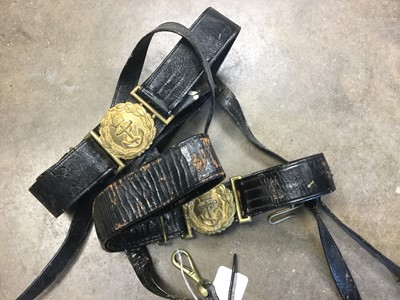 Lot 323 - Second World War Royal Navy black sword belt by Gieves Limited, together with another unnamed. (2)