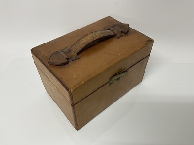 Lot 114 - Drew & Sons brown leather case containing a good quality glass goblet with engraved initials, P.H.W.