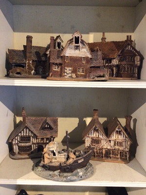 Lot 238 - Six pieces of studio pottery, including five models of houses and one boat group, all stamped 'Suffolk' with other marks