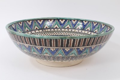 Lot 134 - Middle Eastern bowl, decorated with animals under a tree, patterned ground, 36cm diameter