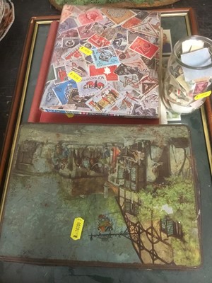 Lot 214 - Two folders of stamps, framed cigarette cards and a tin of tea cards