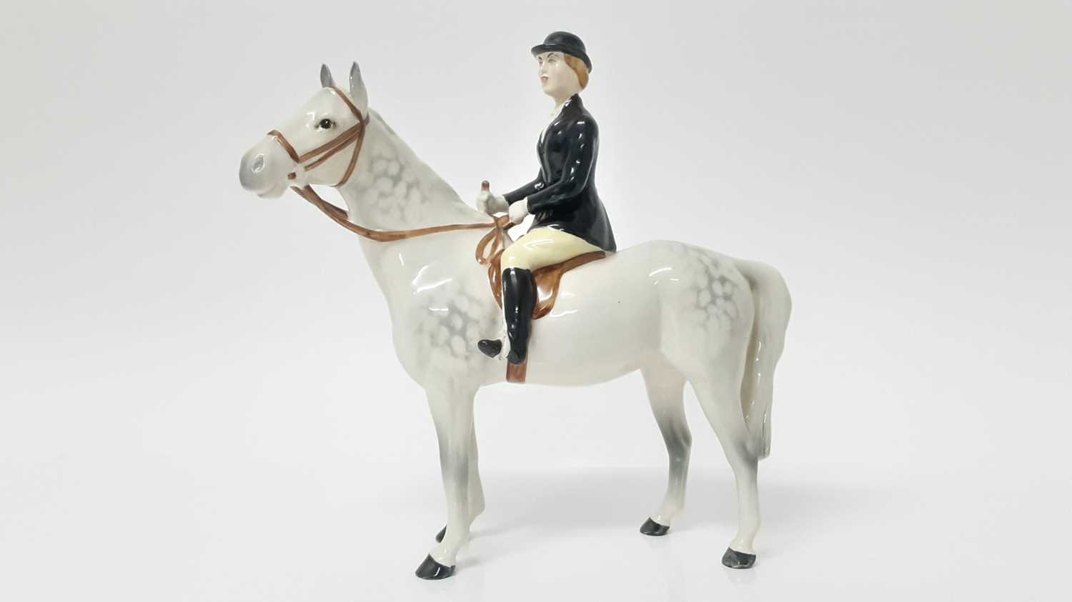 Lot 18 - Beswick Huntswoman, style 2, rider and horse stood still, model no. 1730, designed by Arthur Gredington, 21cm in height