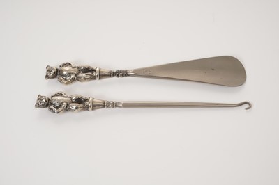 Lot 335 - Edwardian silver teddy bear mounted shoe horn and button hook