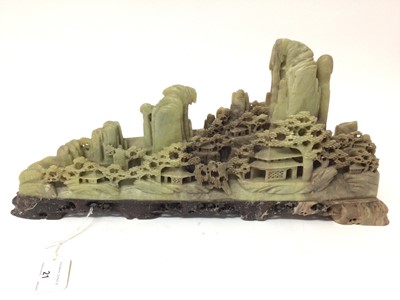 Lot 605 - Good 19th century Chinese soapstone carving of a mountain range with pagodas to the wooden landscape below, on pierced base, 43cm long