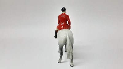 Lot 74 - Beswick Huntsman (style two) model no. 1501, designed by Arthur Gredington, 21cm high, together with two hounds and two foxes (5)