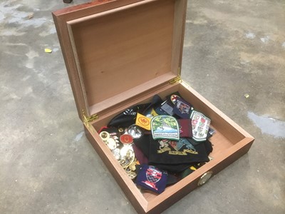 Lot 236 - Burr wood humidor housing a collection of sundry badges