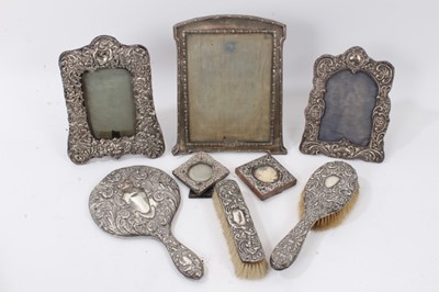 Lot 81 - Group of five silver photograph frames, brushes and mirror