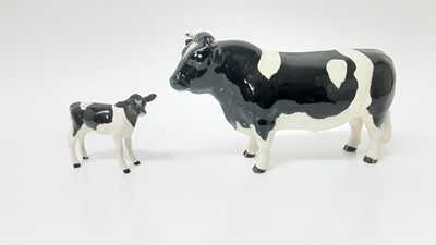 Lot 91 - Beswick Friesian Cow - CH Claybury Legwater, model no. 1362A, designed by Arthur Gredington, 11.9cm high, together with Friesian Calf (2)