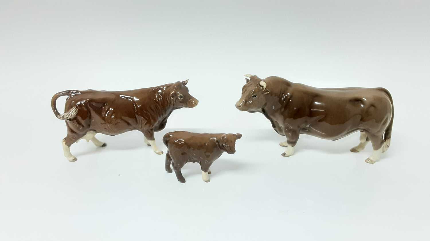 Lot 94 - Beswick BCC Limousin Bull, model no. 2463, designed by Alan Maslankowski, together with a BCC Limousin cow and calf (3)