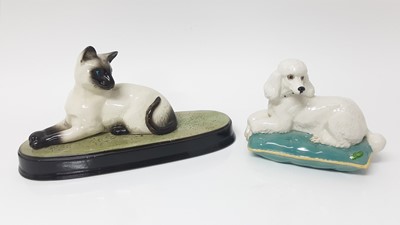 Lot 111 - Beswick Cat on plinth base, Beswick Poodle on cushion, and seven other Beswick dogs (11)