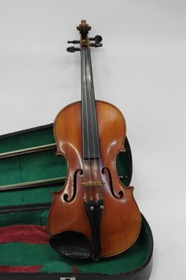 Lot 2356 - Late 19th / early 20th century violin with two bows, cased