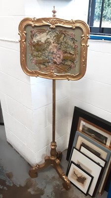 Lot 1273 - Gilt and needlework pole screen