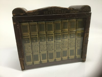 Lot 1709 - Miniature bookcase glazed, with complete works of Shakespeare published by Charles Tilt. C.1830