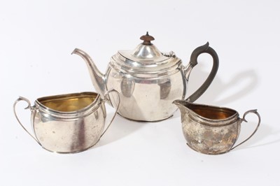 Lot 351 - Silver teapot with matching silver sugar basin and silver cream jug of oval navette form (London 1927)