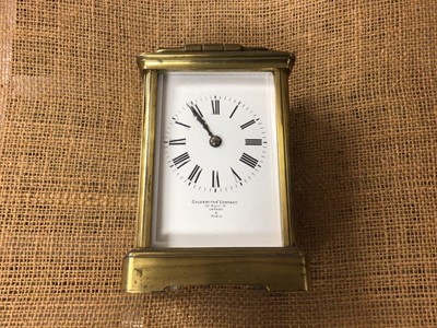 Lot 505 - Goldsmiths' & Company brass carriage clock and key