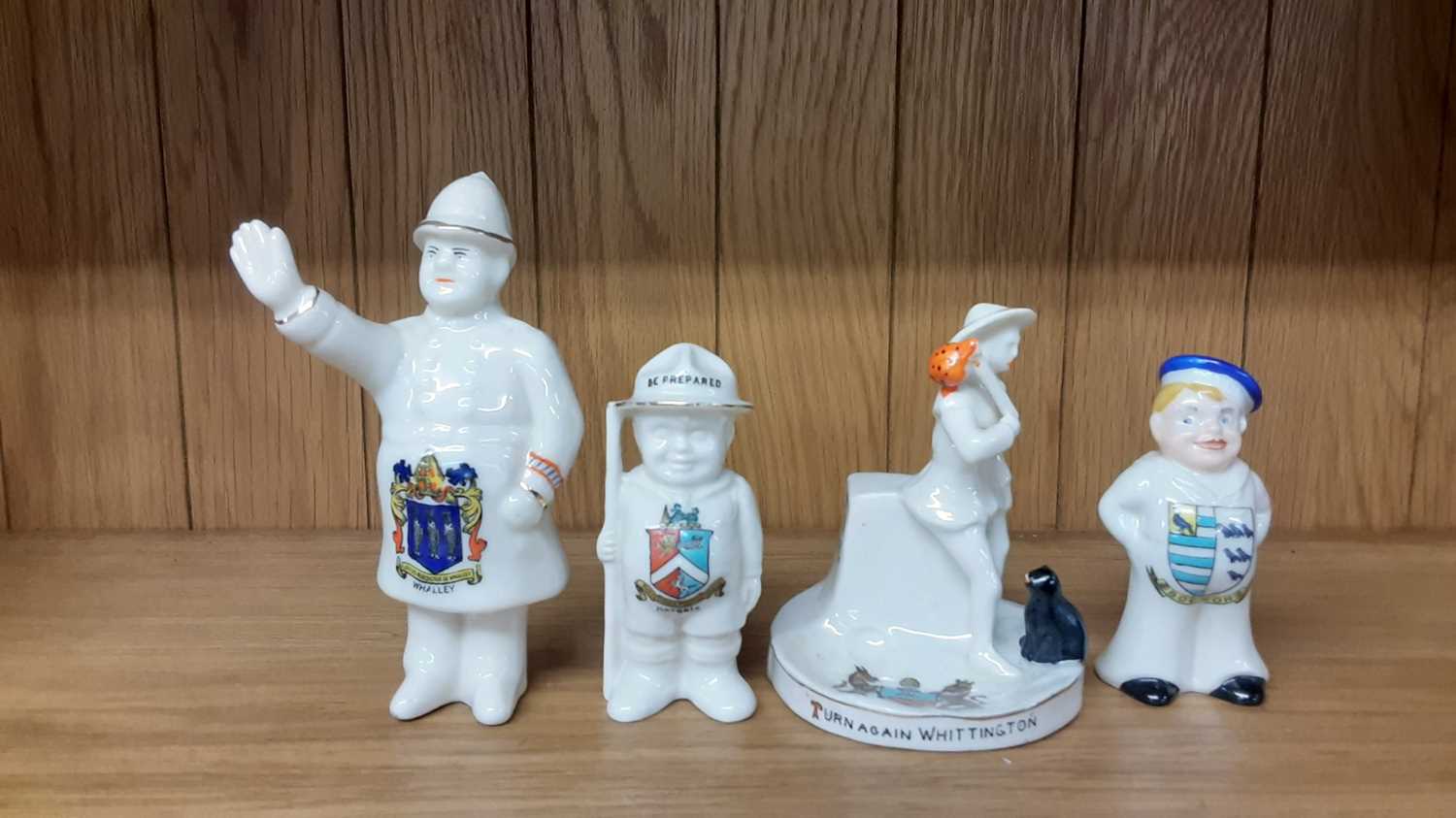 Lot 167 - Selection of Crested China models including Policeman, Boy Scout, Lighthouse etc, various manufacturers to include Carlton, Willow Art and Shelley