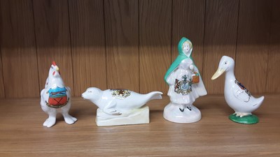Lot 167 - Selection of Crested China models including Policeman, Boy Scout, Lighthouse etc, various manufacturers to include Carlton, Willow Art and Shelley