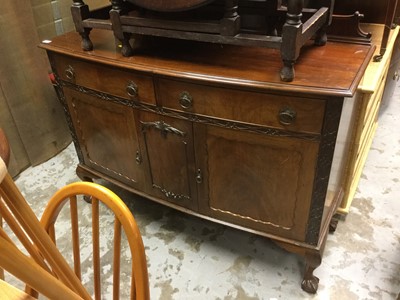 Lot 1014 - 1920's mahogany sideboard with carved decoration and ledge back, on claw and ball feet.