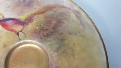 Lot 1246 - Royal Worcester cabinet cup and saucer, hand decorated with Pheasants, signed Jas Stinton