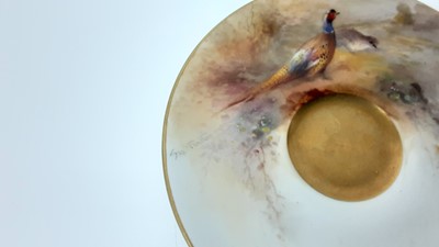 Lot 1247 - Royal Worcester cabinet cup and saucer, hand decorated with a Pheasant, signed Jas Stinton