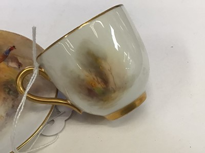 Lot 1247 - Royal Worcester cabinet cup and saucer, hand decorated with a Pheasant, signed Jas Stinton