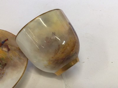 Lot 1247 - Royal Worcester cabinet cup and saucer, hand decorated with a Pheasant, signed Jas Stinton