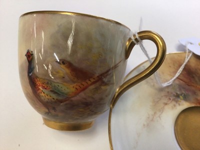 Lot 1247 - Royal Worcester cabinet cup and saucer, hand decorated with a Pheasant, signed Jas Stinton