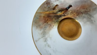 Lot 1249 - Royal Worcester cabinet cup and saucer, hand decorated with a Pheasant, signed Jas Stinton