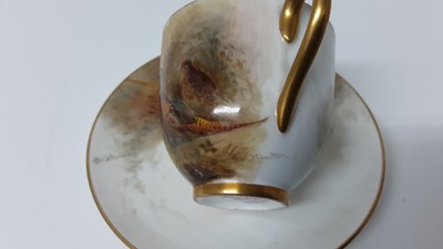 Lot 1249 - Royal Worcester cabinet cup and saucer, hand decorated with a Pheasant, signed Jas Stinton