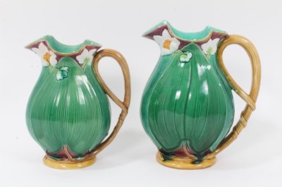 Lot 46 - Two Victorian Minton majolica jugs, moulded with large leaves and flowers, model numbers 1228, 20cm and 22.5cm high