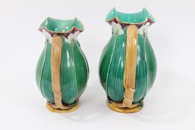 Lot 46 - Two Victorian Minton majolica jugs, moulded with large leaves and flowers, model numbers 1228, 20cm and 22.5cm high