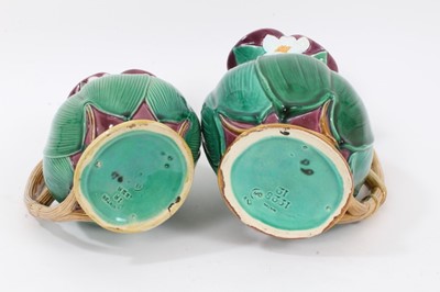Lot 46 - Two Victorian Minton majolica jugs, moulded with large leaves and flowers, model numbers 1228, 20cm and 22.5cm high