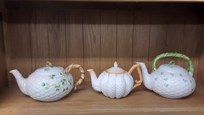Lot 175 - Two Belleek basket weave teapots with Shamrock decoration and one other together with a selection of teaware