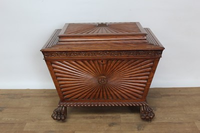 Lot 1431 - Regency Anglo-Indian hardwood cellarette of sarcophagus form, carved 
gadrooned borders, on paw feet and brass castors