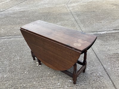 Lot 982 - Early 18th century oak oval dropleaf dining table on turned supports joined by stretchers