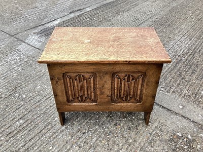 Lot 983 - 17th century-style dwarf oak coffer with linen fold decoration on plank ends