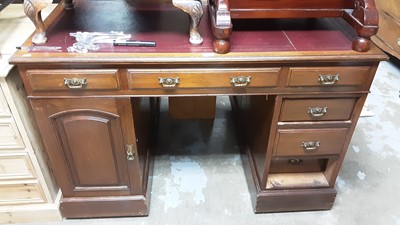 Lot 992 - Edwardian walnut kneehole desk with red leather lined top , cupboard and five drawers
