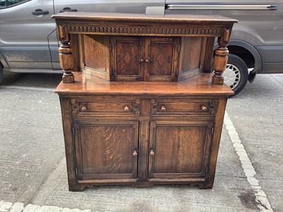 Lot 1006 - 17th century-style oak court cupboard with panelled doors and cup and cover supports