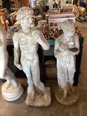 Lot 1032 - Two concrete garden statues, 131cm high and 119cm high