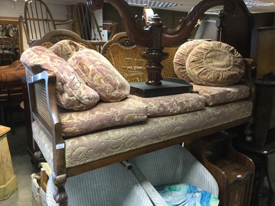 Lot 1018 - Early 20th century oak framed bergere sofa on claw and ball feet