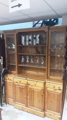Lot 1075 - Ducal pine two height dresser with central open shelves above flanked by two glazed doors, three drawers and four cupboards below, 178cm wide, 46cm deep, 205cm high